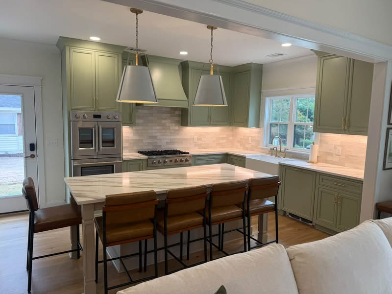 Thompson WoodWorks kitchen with Evergreen Fog inset cabinetry, custom doors and a central island